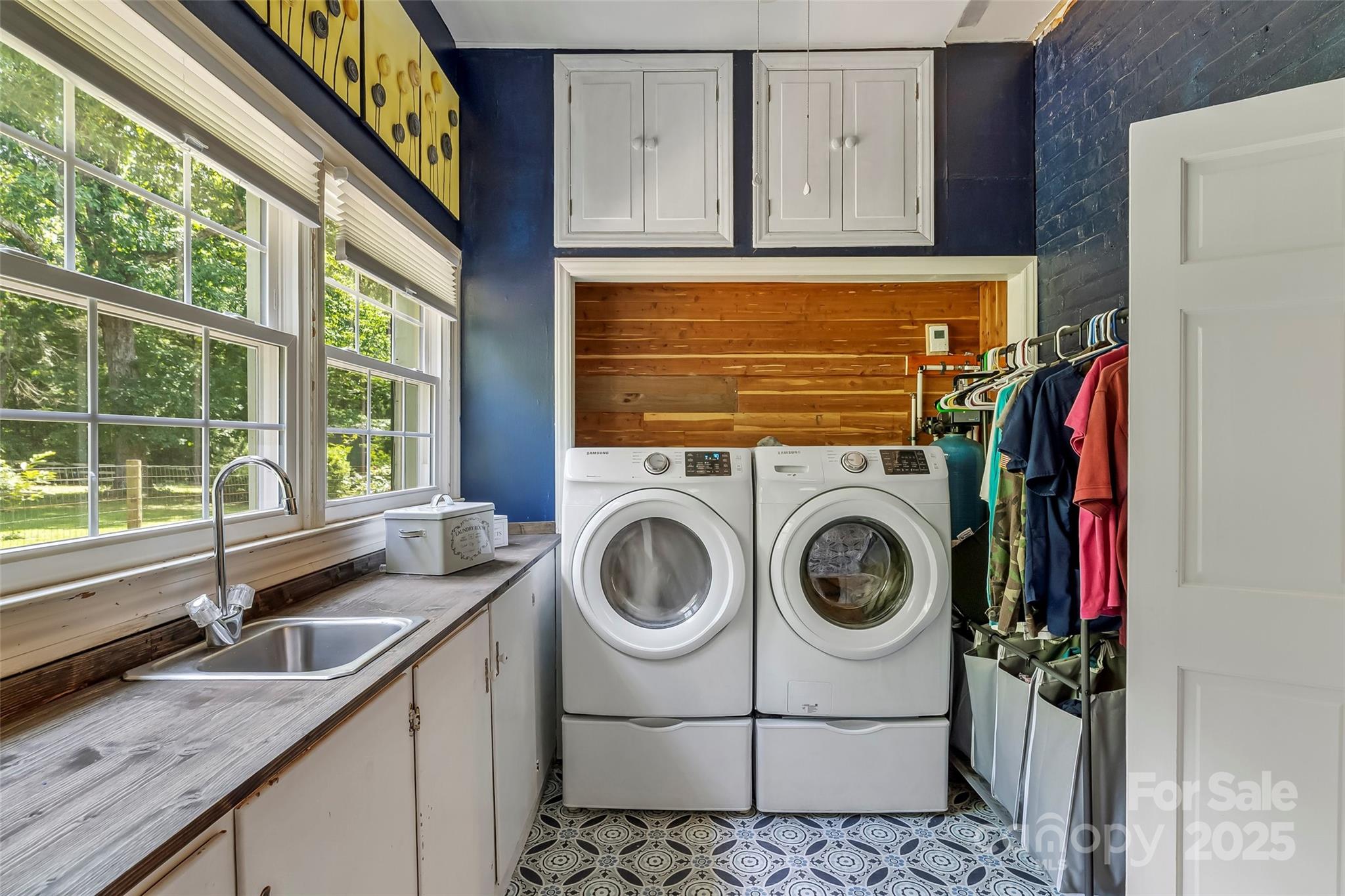 958 Highway 18 Morganton, NC 28655 - Photo 23 of 44 a bathroom with a sink a washer and dryer next to a window