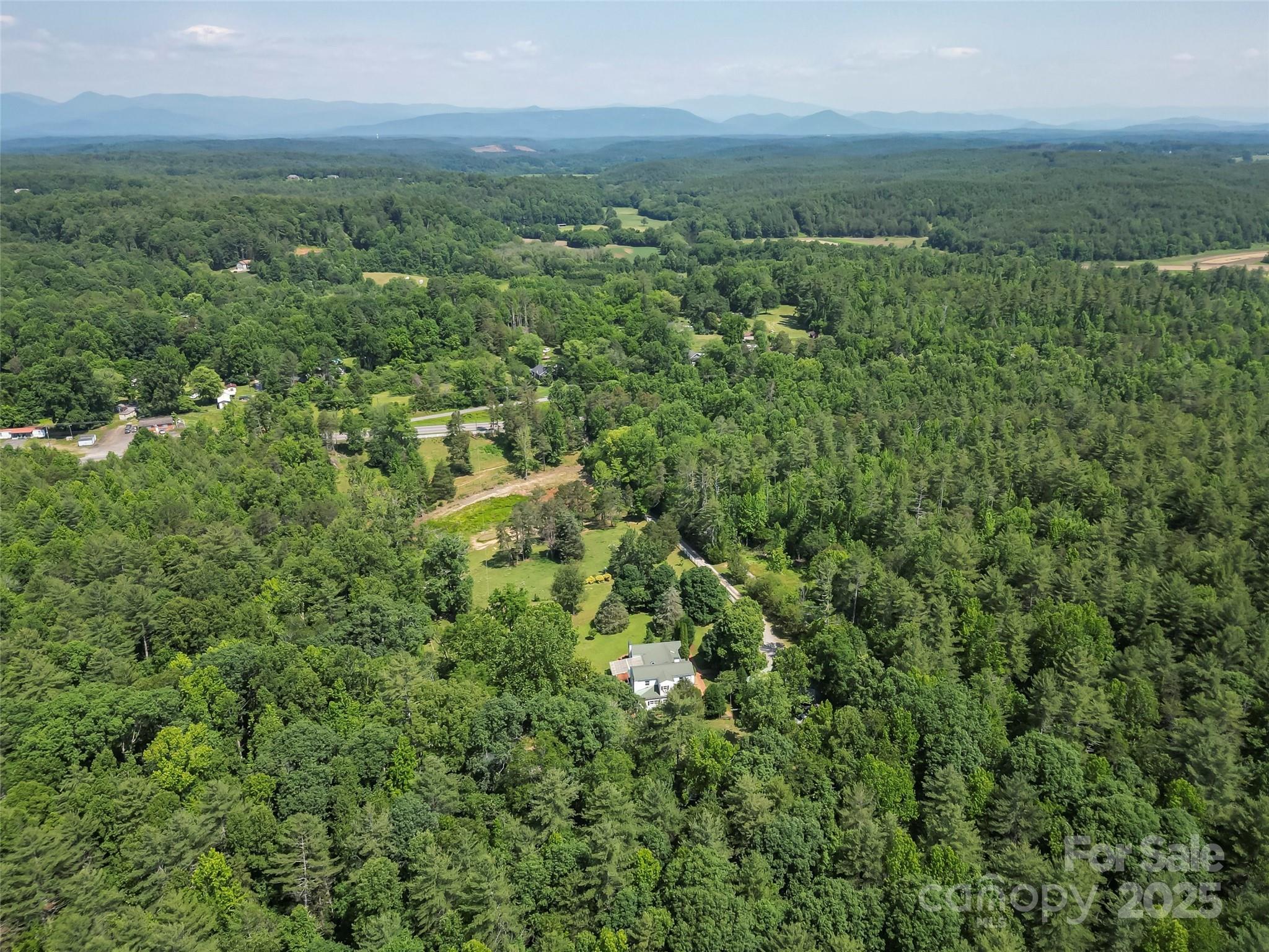 958 Highway 18 Morganton, NC 28655 - Photo 39 of 44 an aerial view of residential houses with outdoor and green space