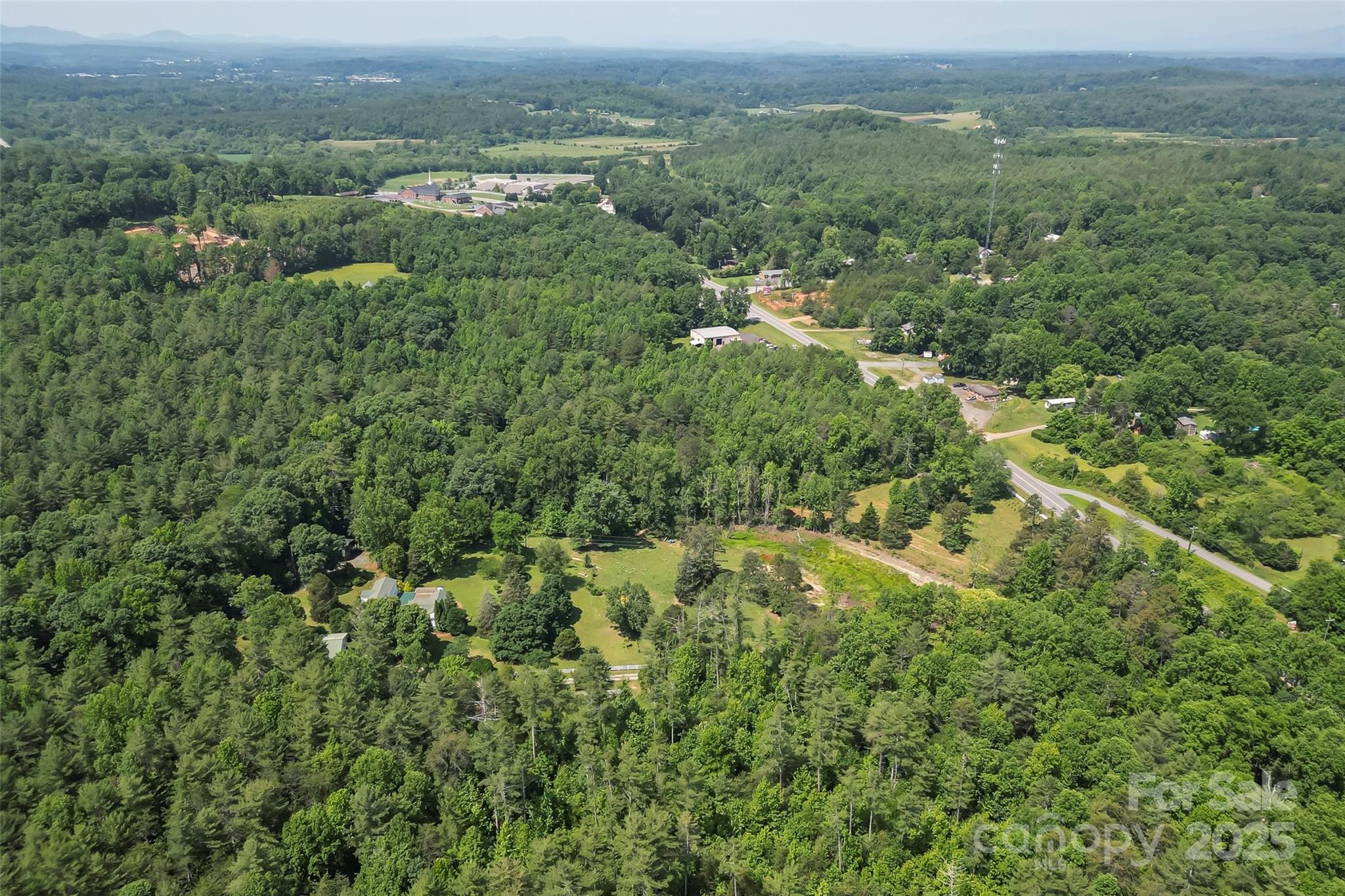 958 Highway 18 Morganton, NC 28655 - Photo 40 of 44 an aerial view of residential houses with outdoor and green space