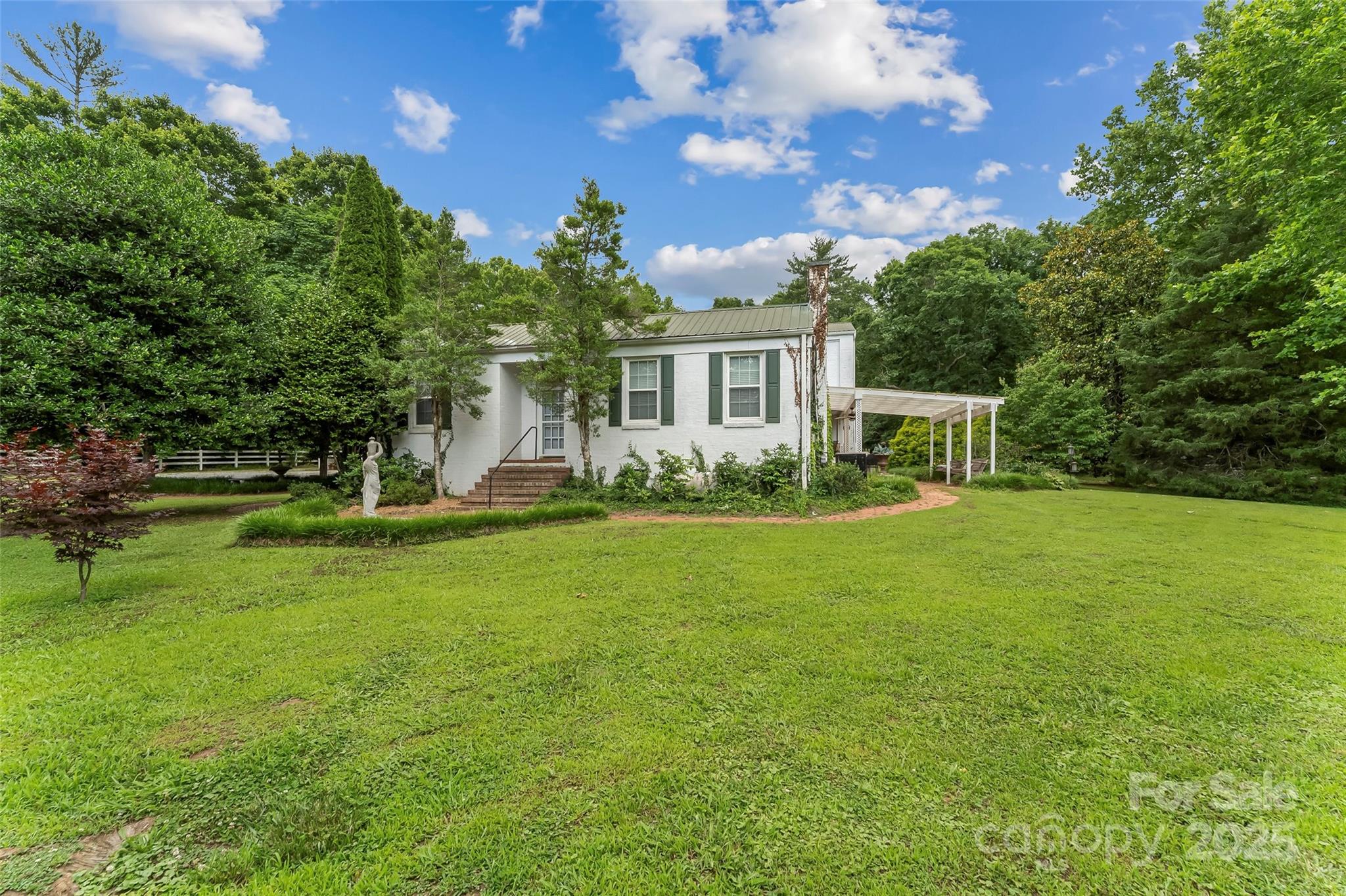 958 Highway 18 Morganton, NC 28655 - Photo 6 of 44 a front view of a house with garden
