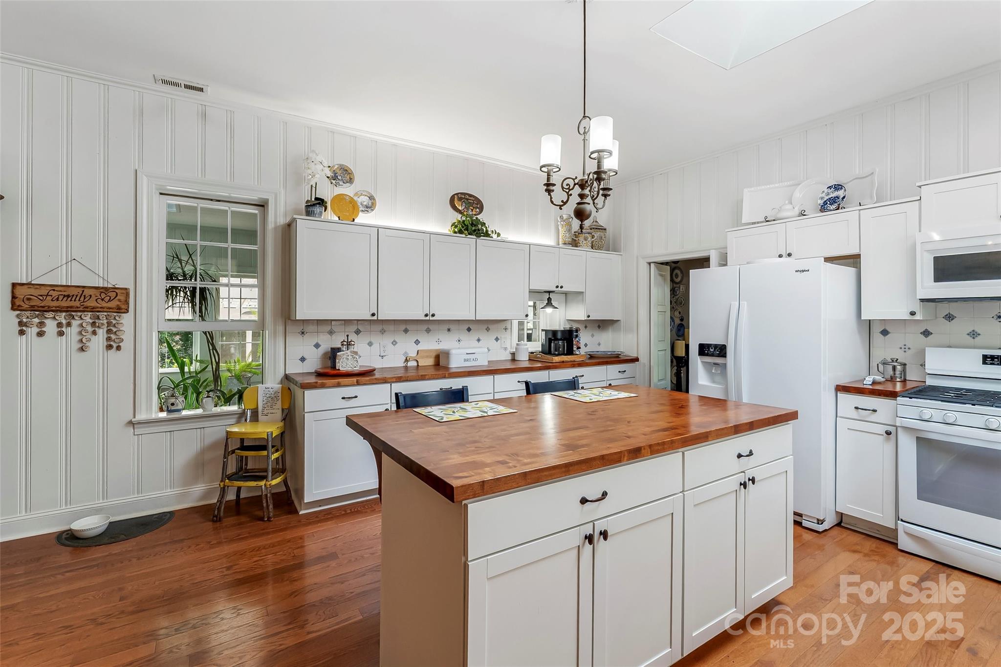 958 Highway 18 Morganton, NC 28655 - Photo 9 of 44 a kitchen with kitchen island granite countertop a sink a center island and appliances