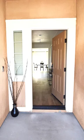 a view of an entryway with wooden floor
