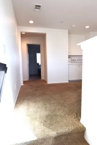 a bathroom with a double vanity sink mirror and shower