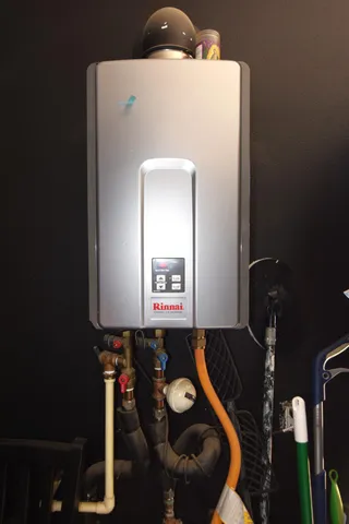 a bathroom with a sink a toilet and shower curtain