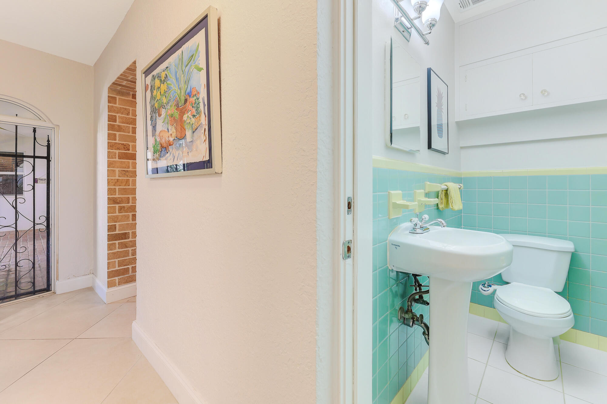 2560 Southeast 7th Drive Pompano Beach, FL 33062 - Photo 27 of 74 a bathroom with a sink toilet and a mirror