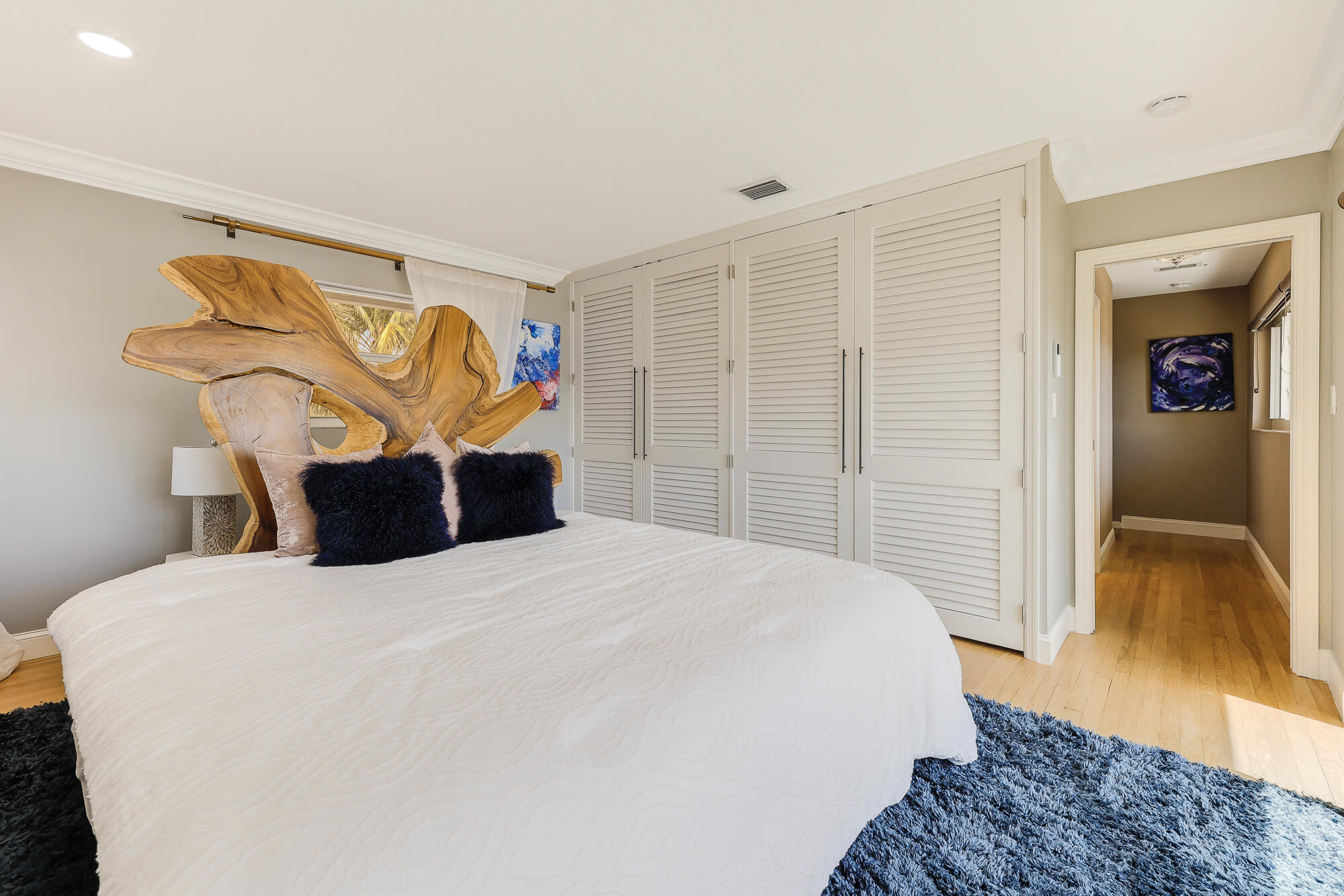 2560 Southeast 7th Drive Pompano Beach, FL 33062 - Photo 32 of 74 a bedroom with a bed and a chandelier