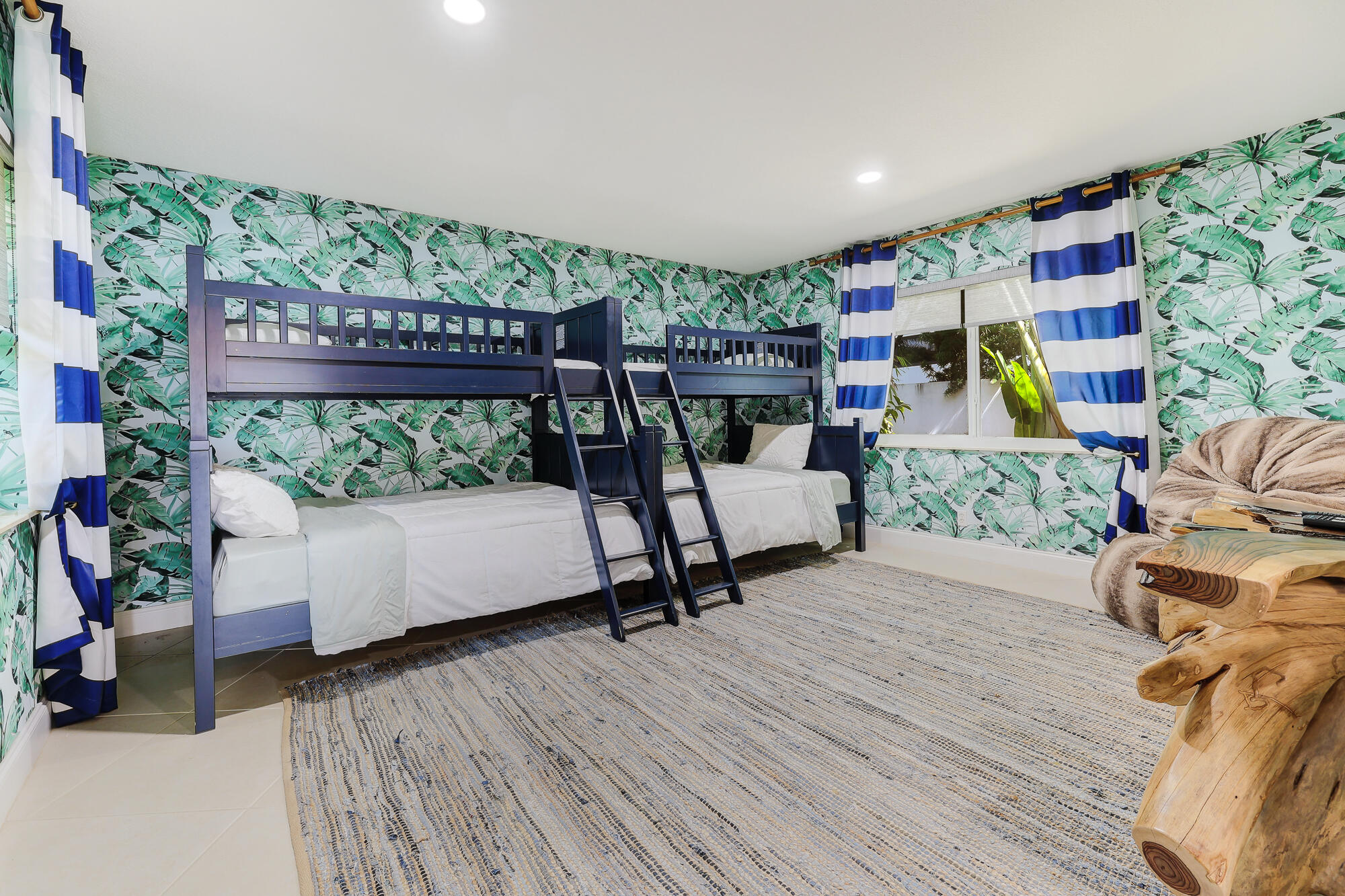 2560 Southeast 7th Drive Pompano Beach, FL 33062 - Photo 36 of 74 a living room with furniture and a floor to ceiling window