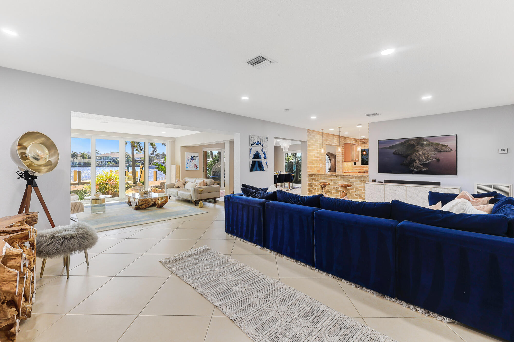 2560 Southeast 7th Drive Pompano Beach, FL 33062 - Photo 6 of 74 a living room with furniture and a flat screen tv