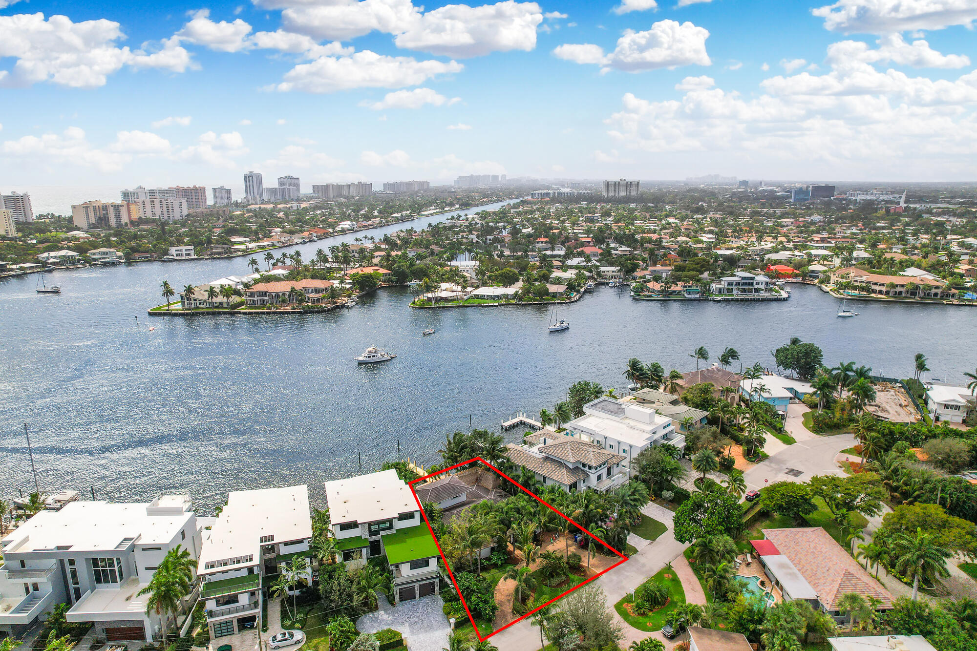 2560 Southeast 7th Drive Pompano Beach, FL 33062 - Photo 64 of 74 an aerial view of a city with lots of residential buildings ocean and mountain view in back