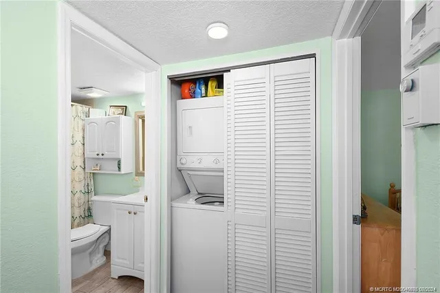 a bathroom with a toilet a sink and a shower