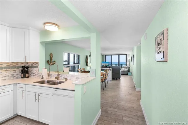 a kitchen with a sink and cabinets