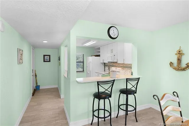 a view of a kitchen and dining area with furniture