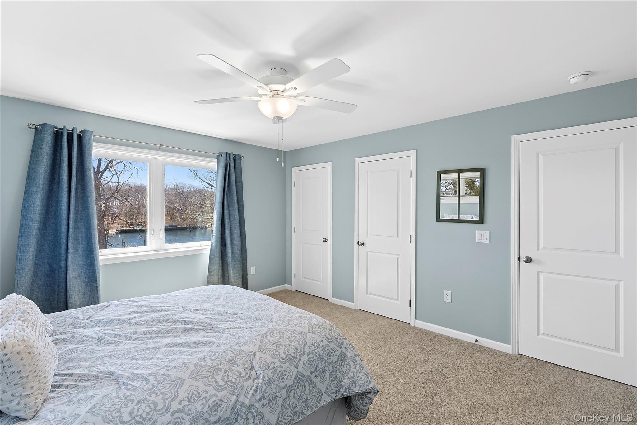 2280 Deep Hole Drive Mattituck, NY 11952 - Photo 13 of 35 Guest bedroom featuring multiple closets