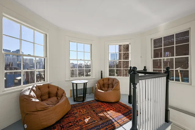 a living room with furniture and windows