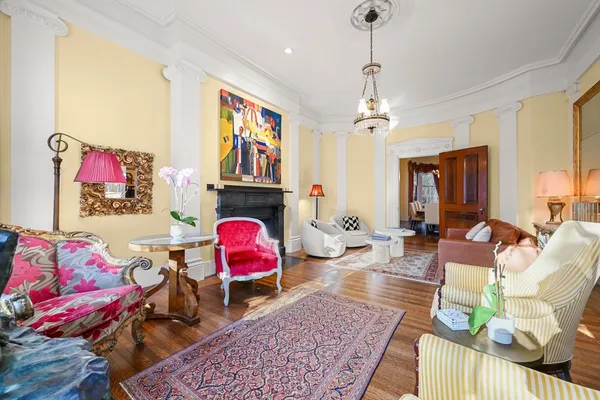 a living room with furniture rug and window