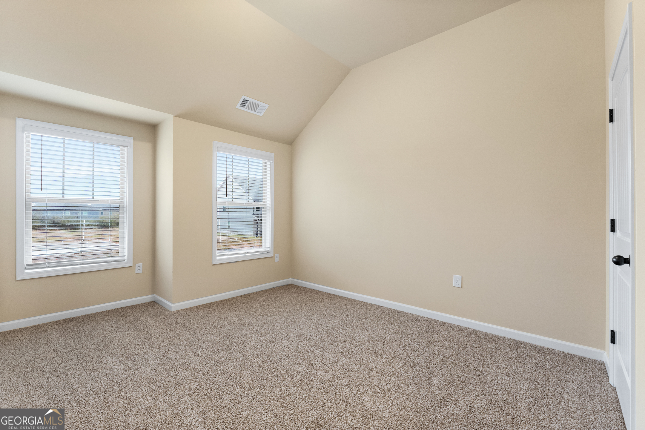 2325 Walker Drive, Unit 10 Hampton, GA 30228 - Photo 12 of 19 a view of an empty room with a window