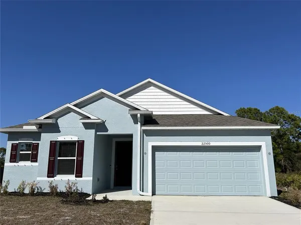 a front view of a house with garage