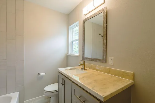 a bathroom with a sink and a toilet