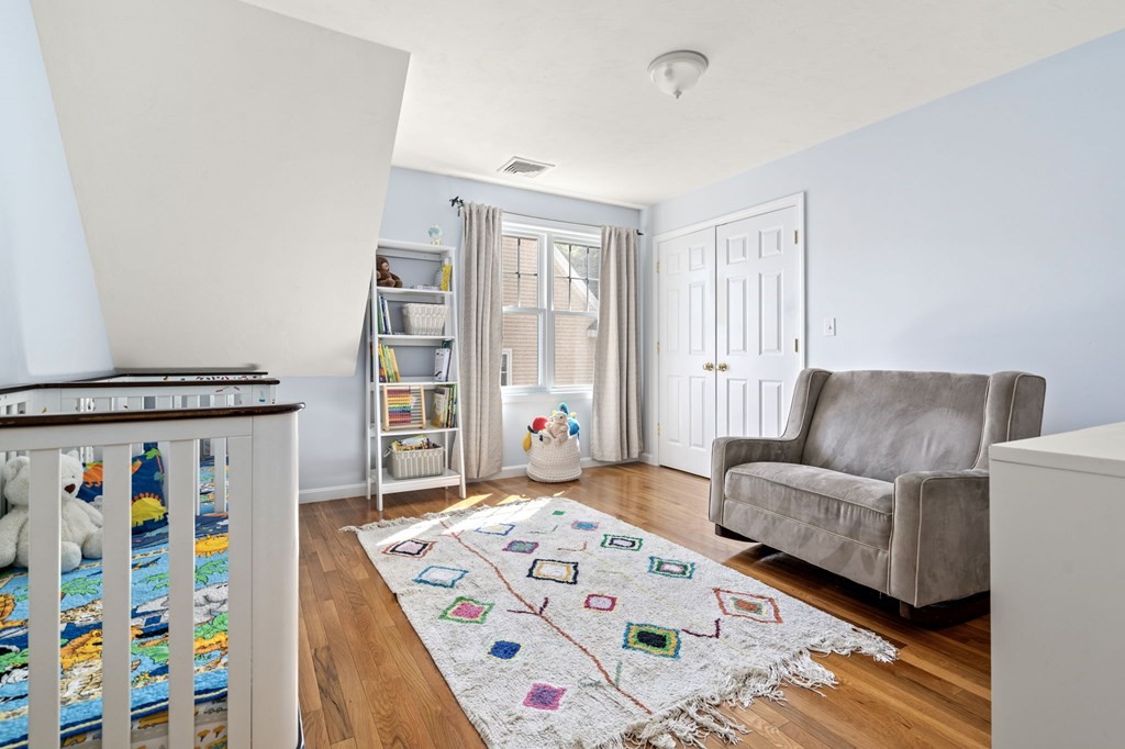 8 Maple Leaf Drive Boston, MA 02136 - Photo 17 of 29 a bedroom with furniture and a baby crib