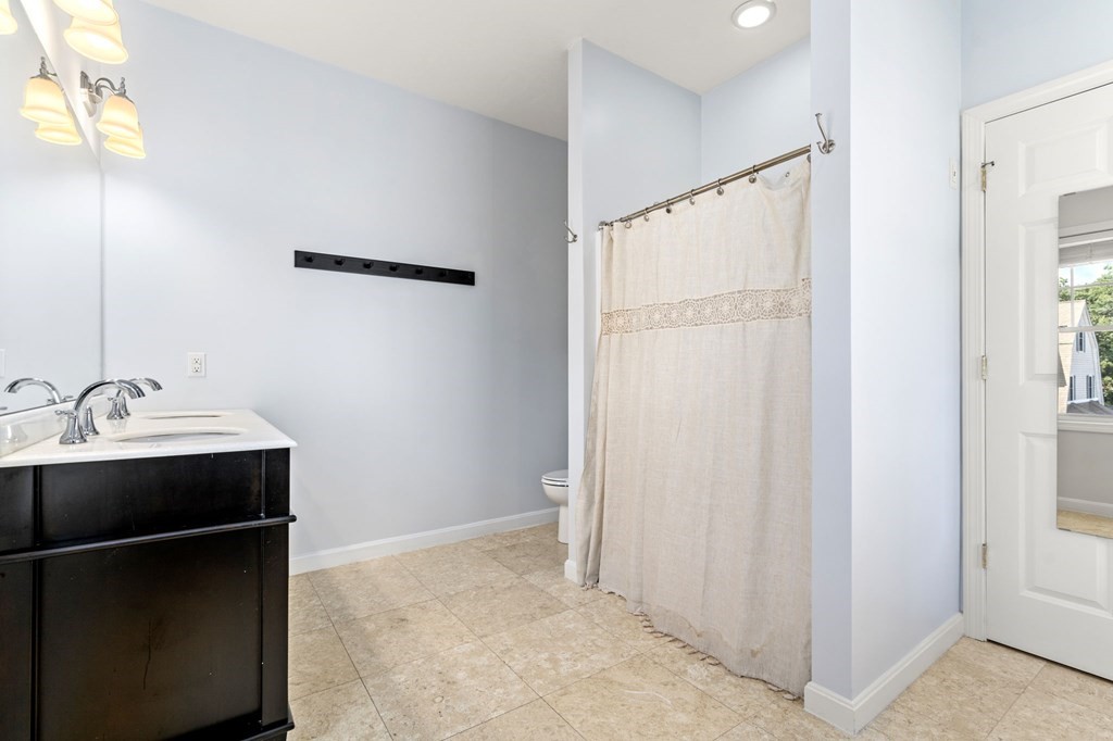 8 Maple Leaf Drive Boston, MA 02136 - Photo 18 of 29 a room with a sink and a mirror