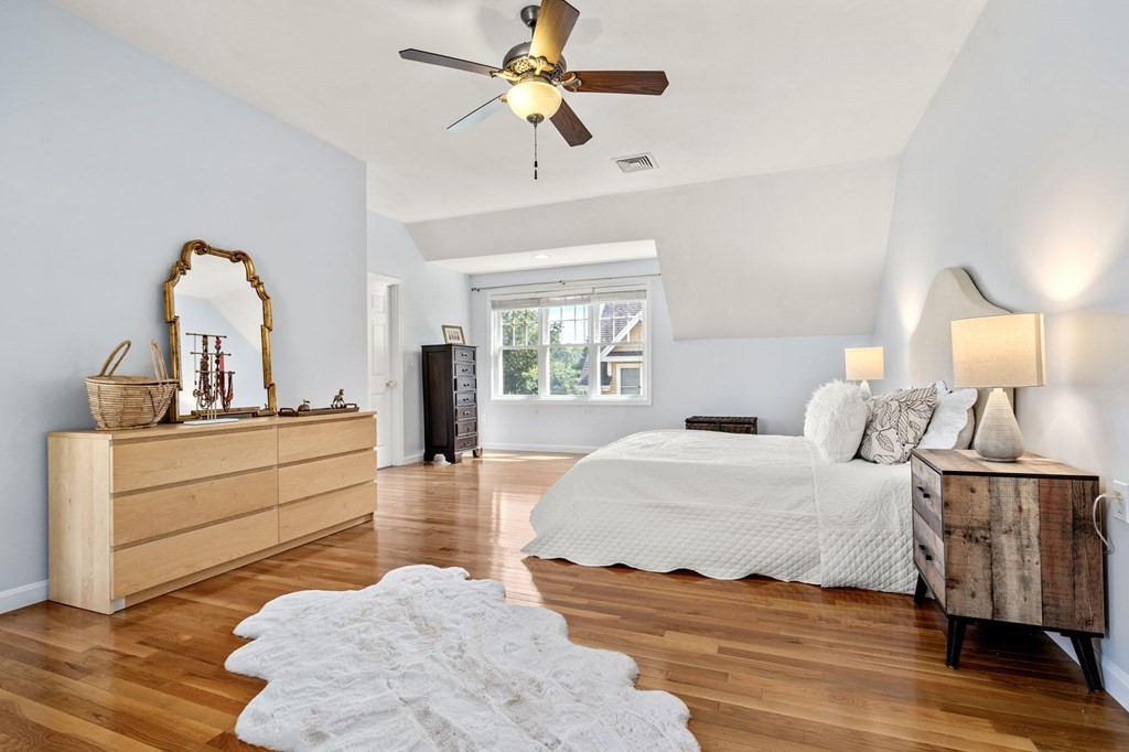 8 Maple Leaf Drive Boston, MA 02136 - Photo 21 of 29 a bedroom with a bed and a chandelier