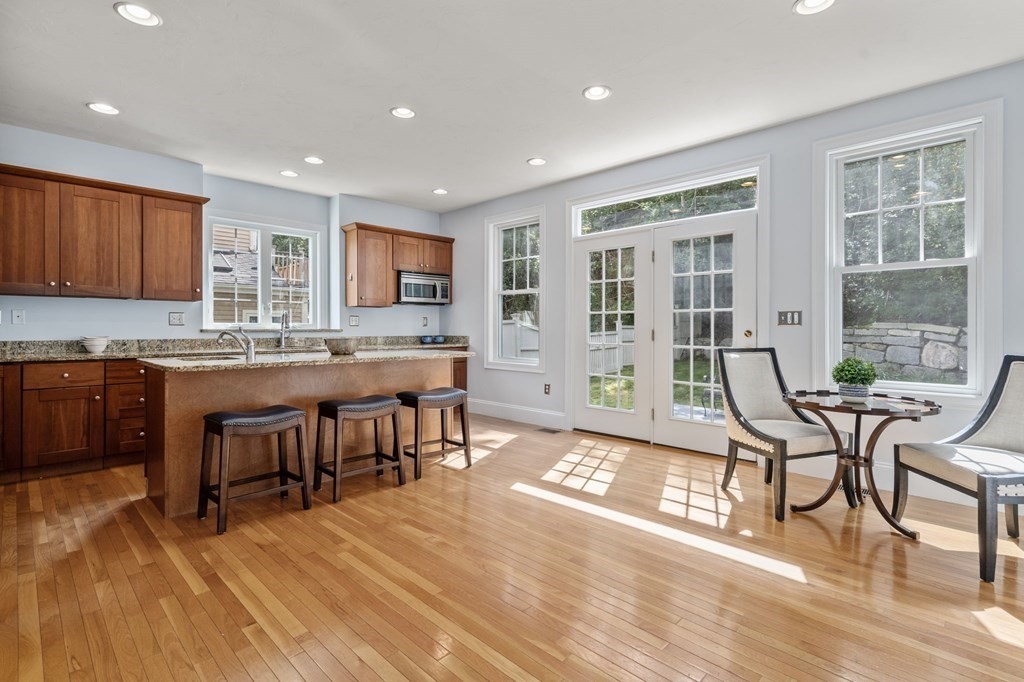 8 Maple Leaf Drive Boston, MA 02136 - Photo 8 of 29 a living room with a table chairs and a dining table with wooden floor