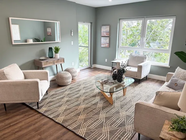 a living room with furniture and a large window