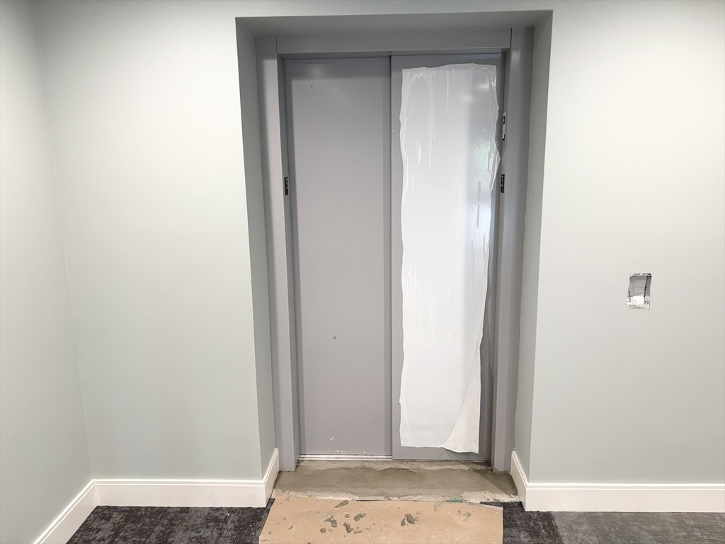 1391 Main Street, Unit 205 Walpole, MA 02081 - Photo 27 of 33 a view of wooden door