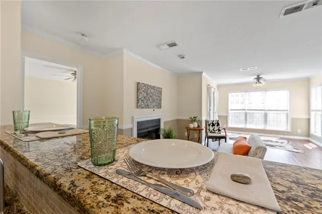 a kitchen with a granite countertop sink and a granite counter top