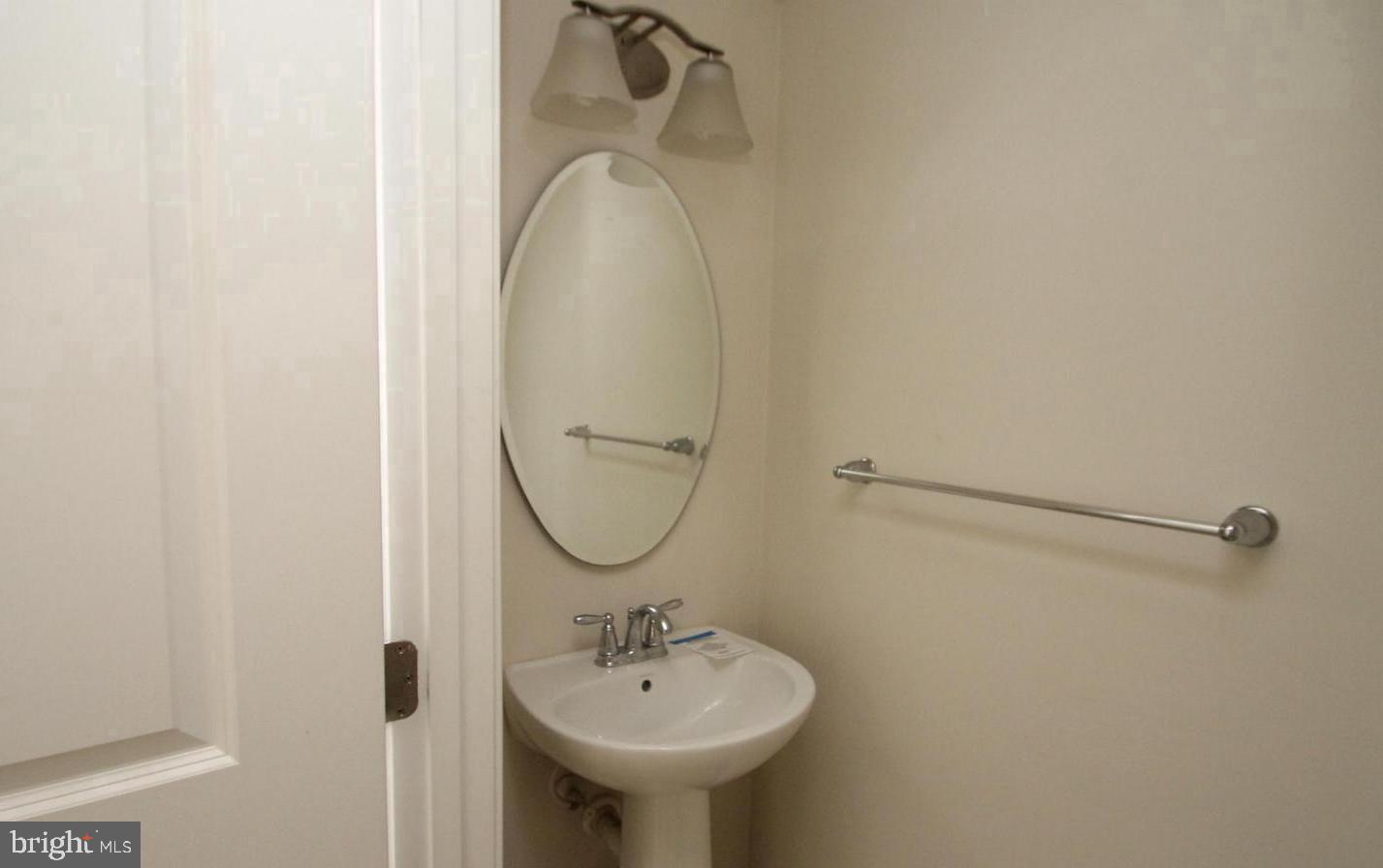 313 Brenton Road, Unit 40 Fredericksburg, VA 22405 - Photo 3 of 18 Charming half-bath with modern fixtures.