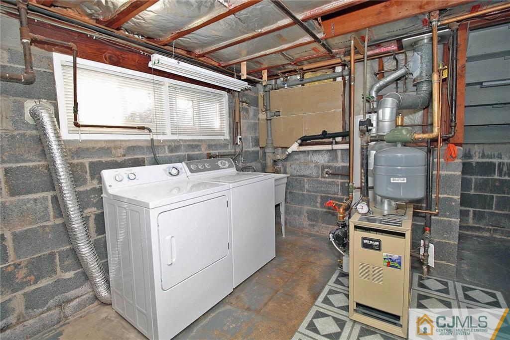 54 Starlight Drive Colonia, NJ 07067 - Photo 22 of 25 a utility room with dryer and washer