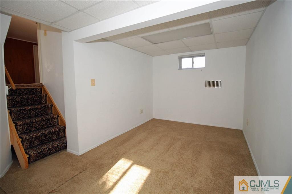 54 Starlight Drive Colonia, NJ 07067 - Photo 4 of 25 a view of wooden floor and windows in a room