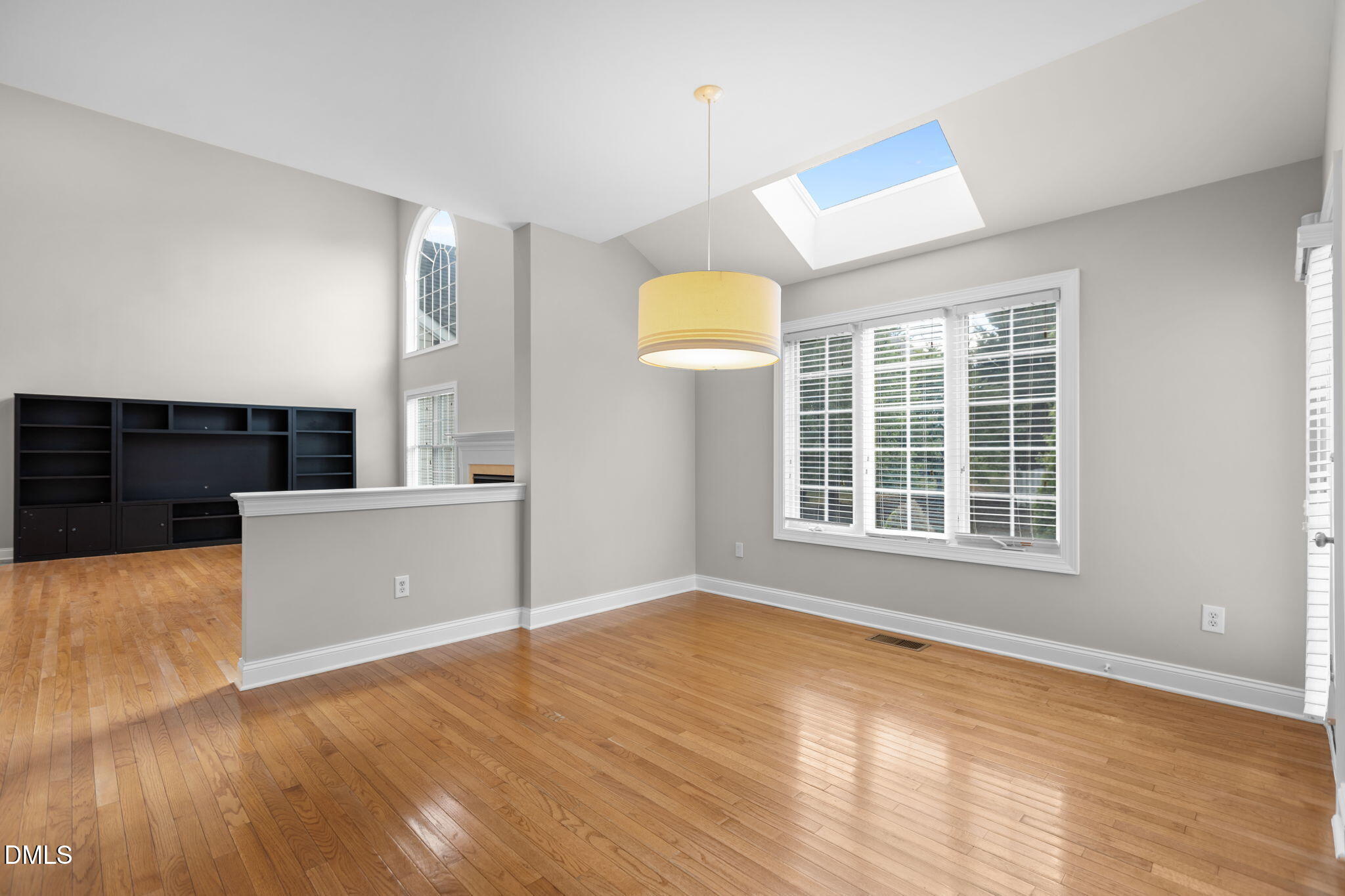 11552 Auldbury Way Raleigh, NC 27617 - Photo 19 of 62 a view of a kitchen with wooden floor and a window