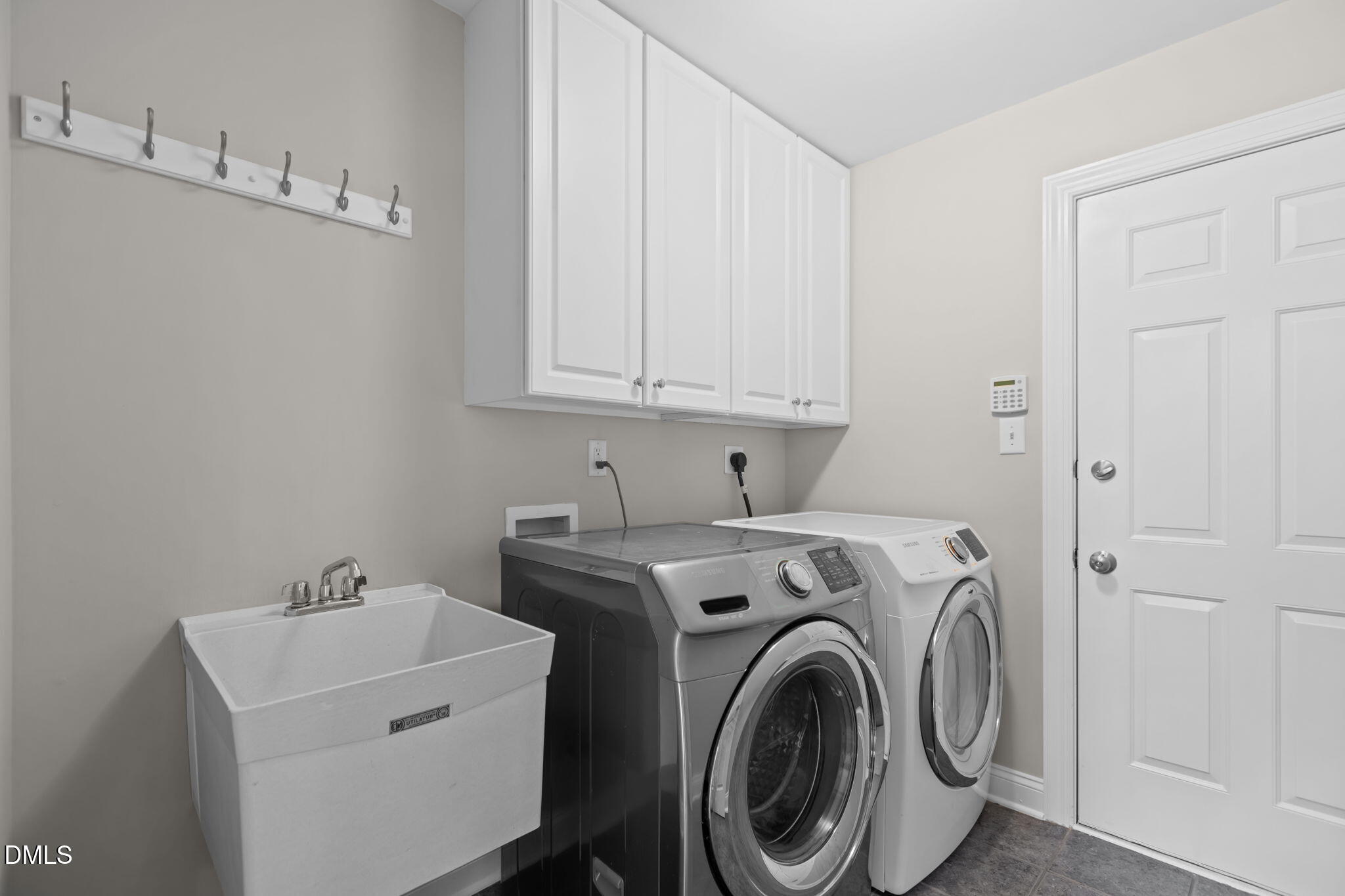 11552 Auldbury Way Raleigh, NC 27617 - Photo 21 of 62 a utility room with dryer and washer