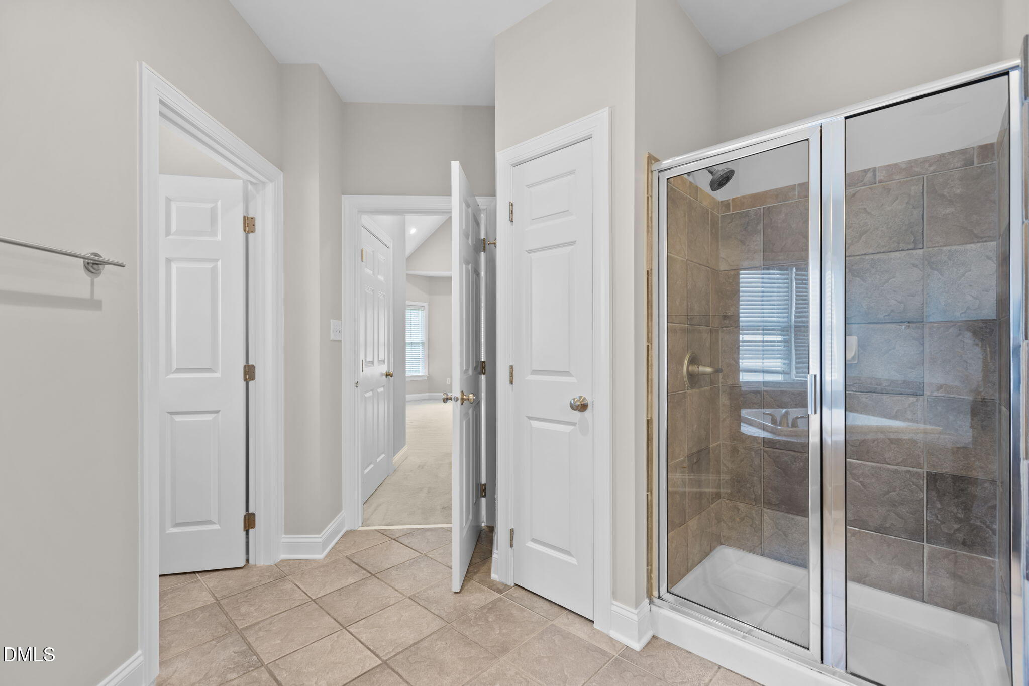 11552 Auldbury Way Raleigh, NC 27617 - Photo 27 of 62 a bathroom with a glass shower door