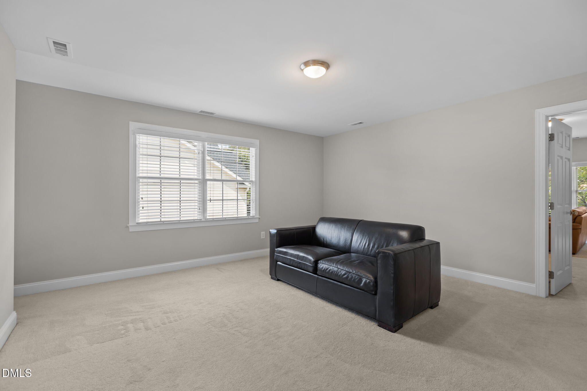 11552 Auldbury Way Raleigh, NC 27617 - Photo 38 of 62 a living room with furniture and a window