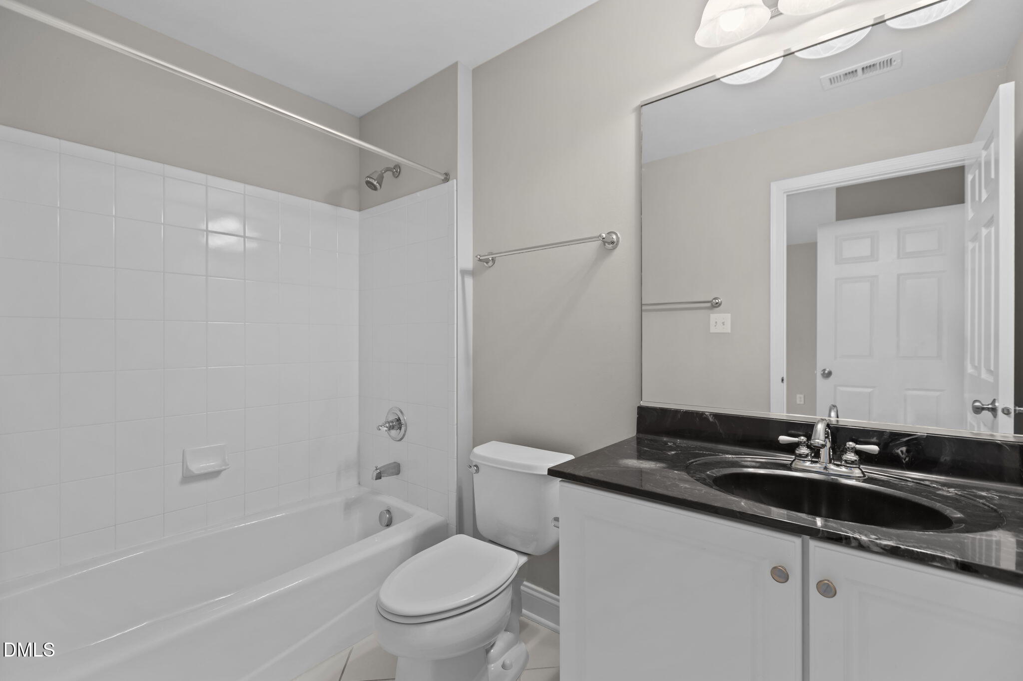 11552 Auldbury Way Raleigh, NC 27617 - Photo 42 of 62 a bathroom with a granite countertop sink a toilet and shower