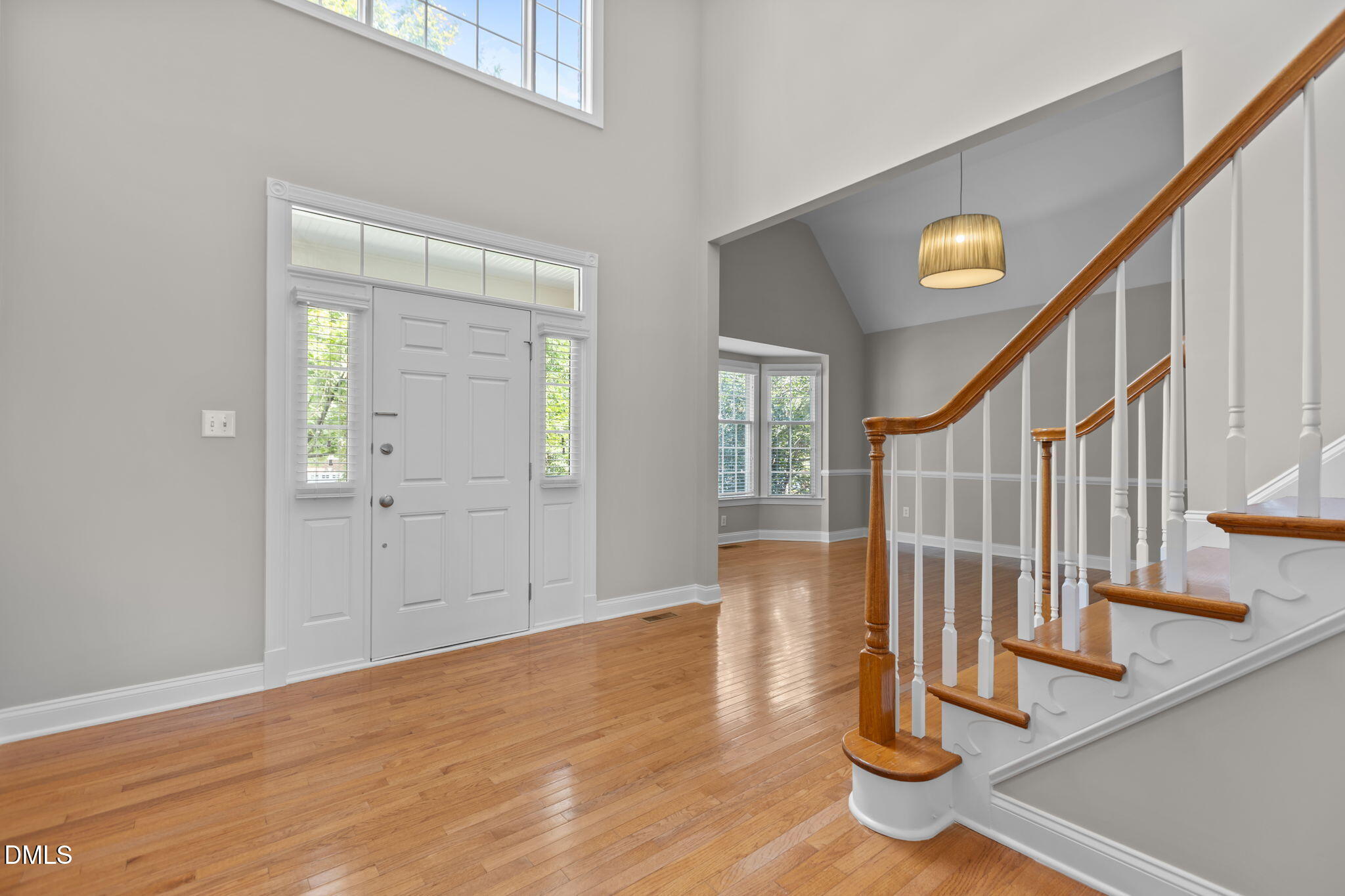 11552 Auldbury Way Raleigh, NC 27617 - Photo 5 of 62 a view of entryway with wooden floor and stairs