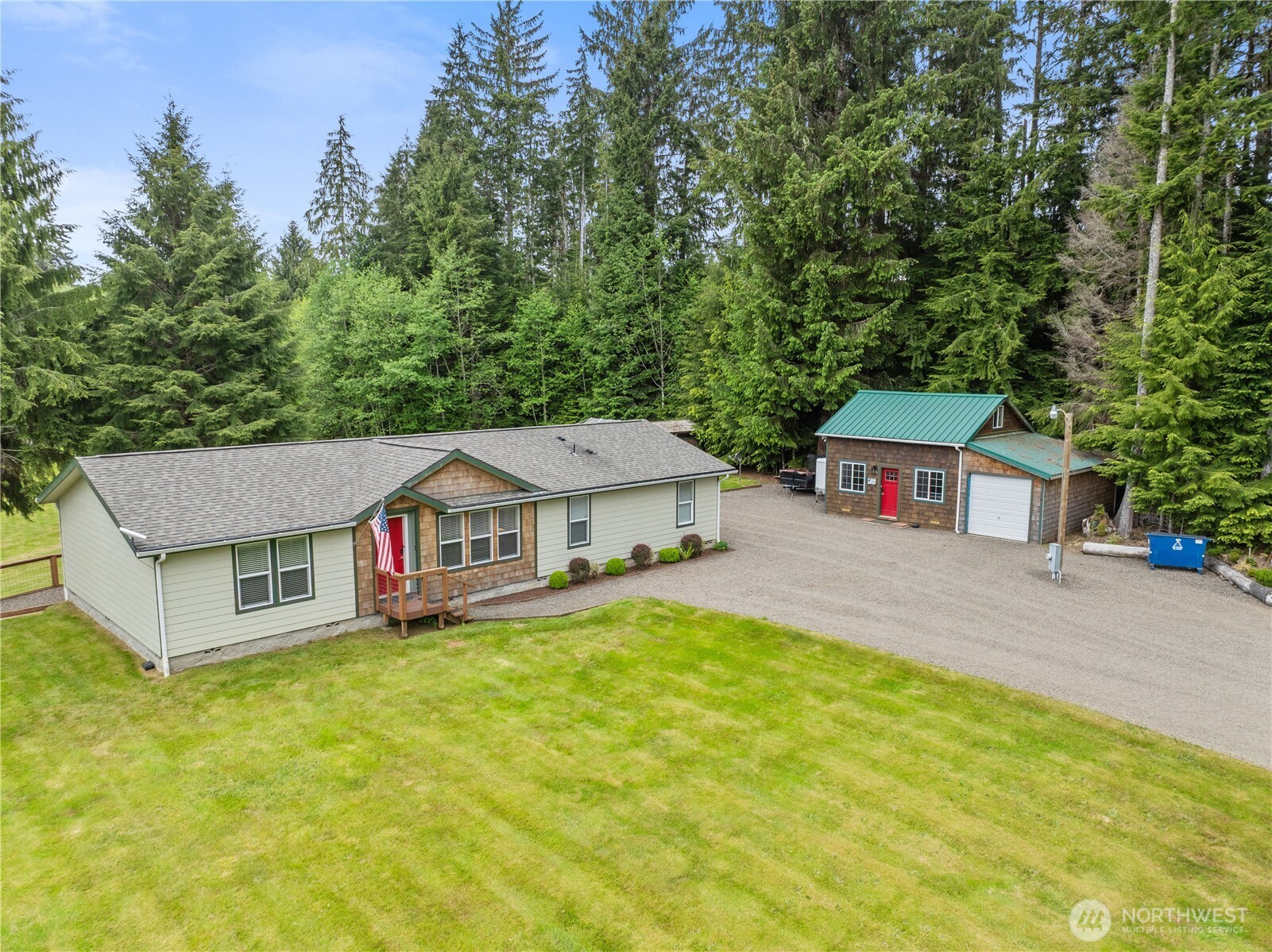 132 River Park Road Forks, WA 98331 - Photo 1 of 40 a front view of a house with a yard and large trees