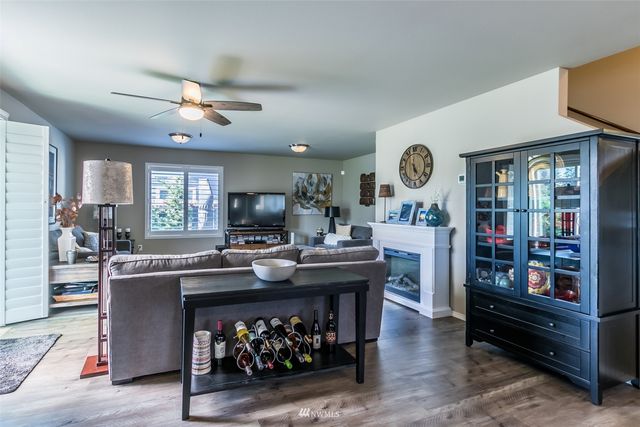 a room with wooden furniture and a clock