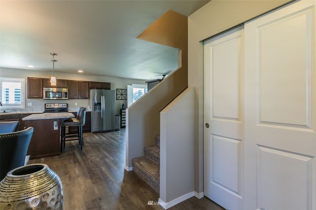 a view of kitchen with furniture and wooden floor
