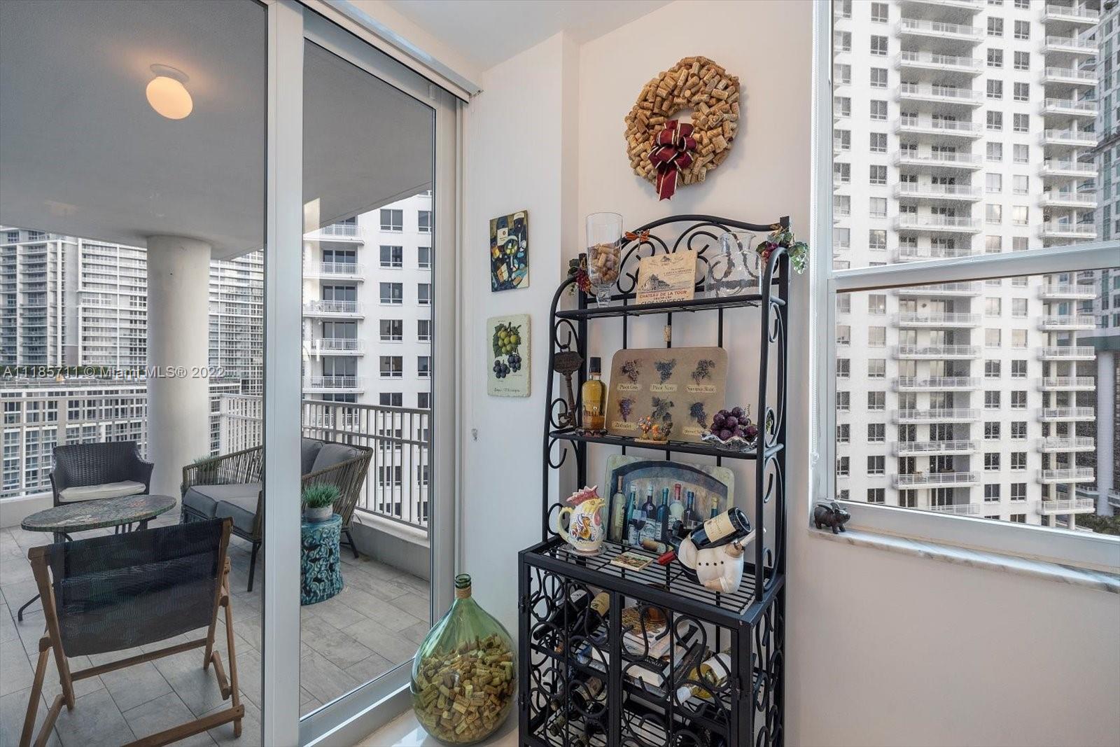 701 Brickell Key Boulevard, Unit 1704 Miami, FL 33131 - Photo 9 of 31 a view of a balcony with chairs