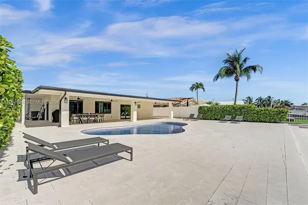a view of kitchen with furniture and wooden floor