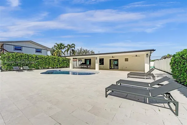 a view of a livingroom with furniture nad wooden floor