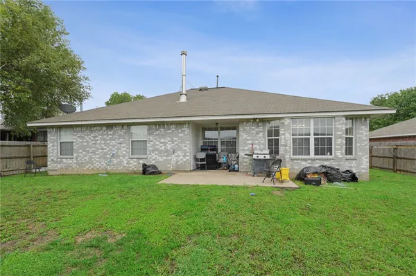 a front view of a house with a yard and porch