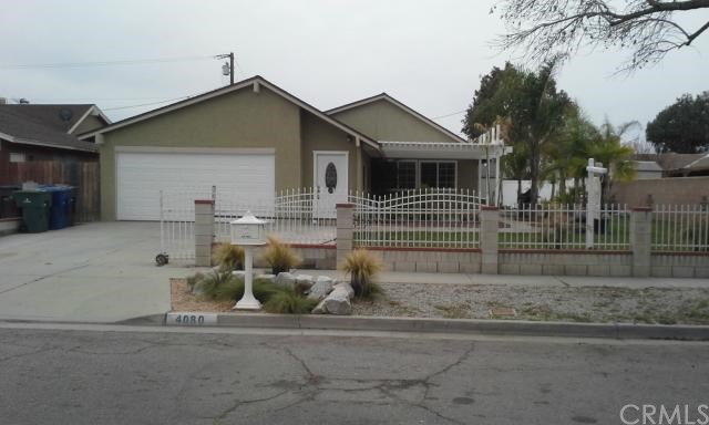 4080 Strawberry Street Riverside, CA 92501 - Photo 1 of 1 a view of a house with a yard