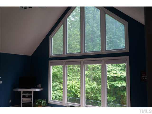 6404 Pernod Way Raleigh, NC 27613 - Photo 8 of 24 Gorgeous wall of windows looking out onto wooded lot. Den/Family/Great Room