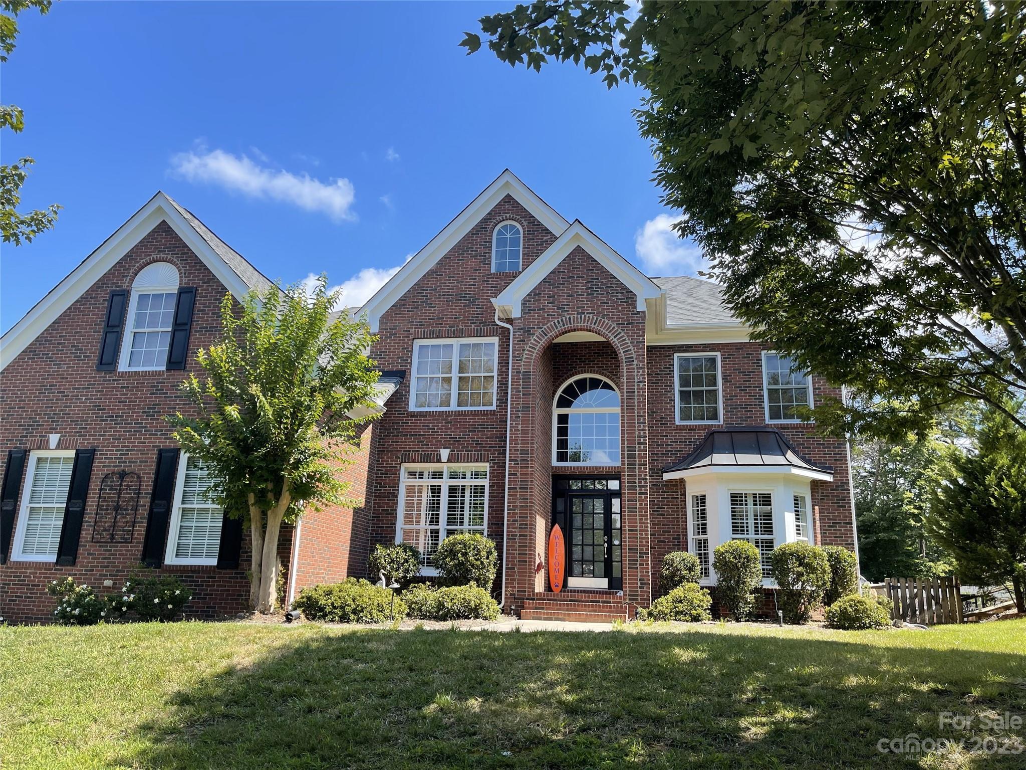 734 Fairway Point Drive Tega Cay, SC 29708 - Photo 1 of 8 a front view of a house with a yard