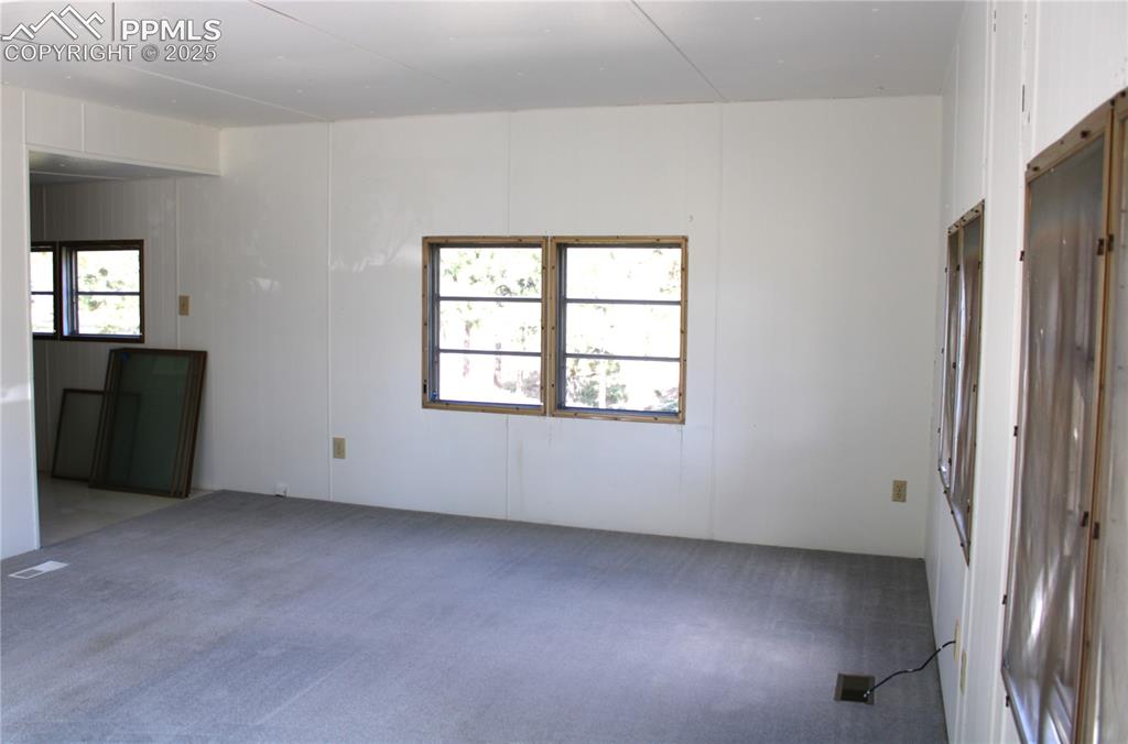 8320 Piute Road Colorado Springs, CO 80926 - Photo 5 of 20 an empty room with windows