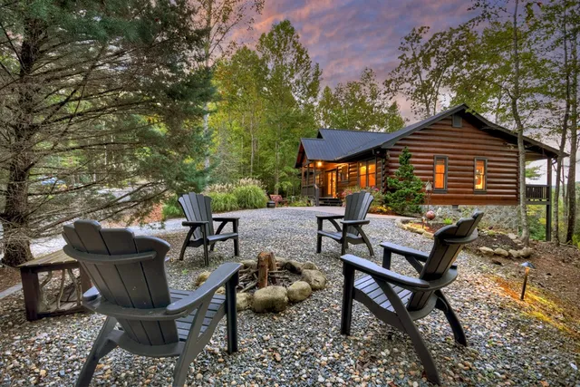 a backyard of a house with yard and outdoor seating